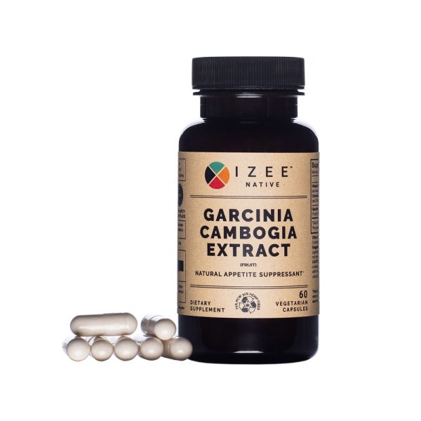 Photo of a pill bottle labeled Garcinia Cambogia Extract and gel caps laying next to bottle.